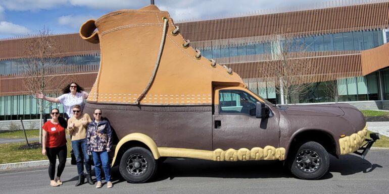 Portland Webworks project managers in front for the LL.Bean Bootmobile.