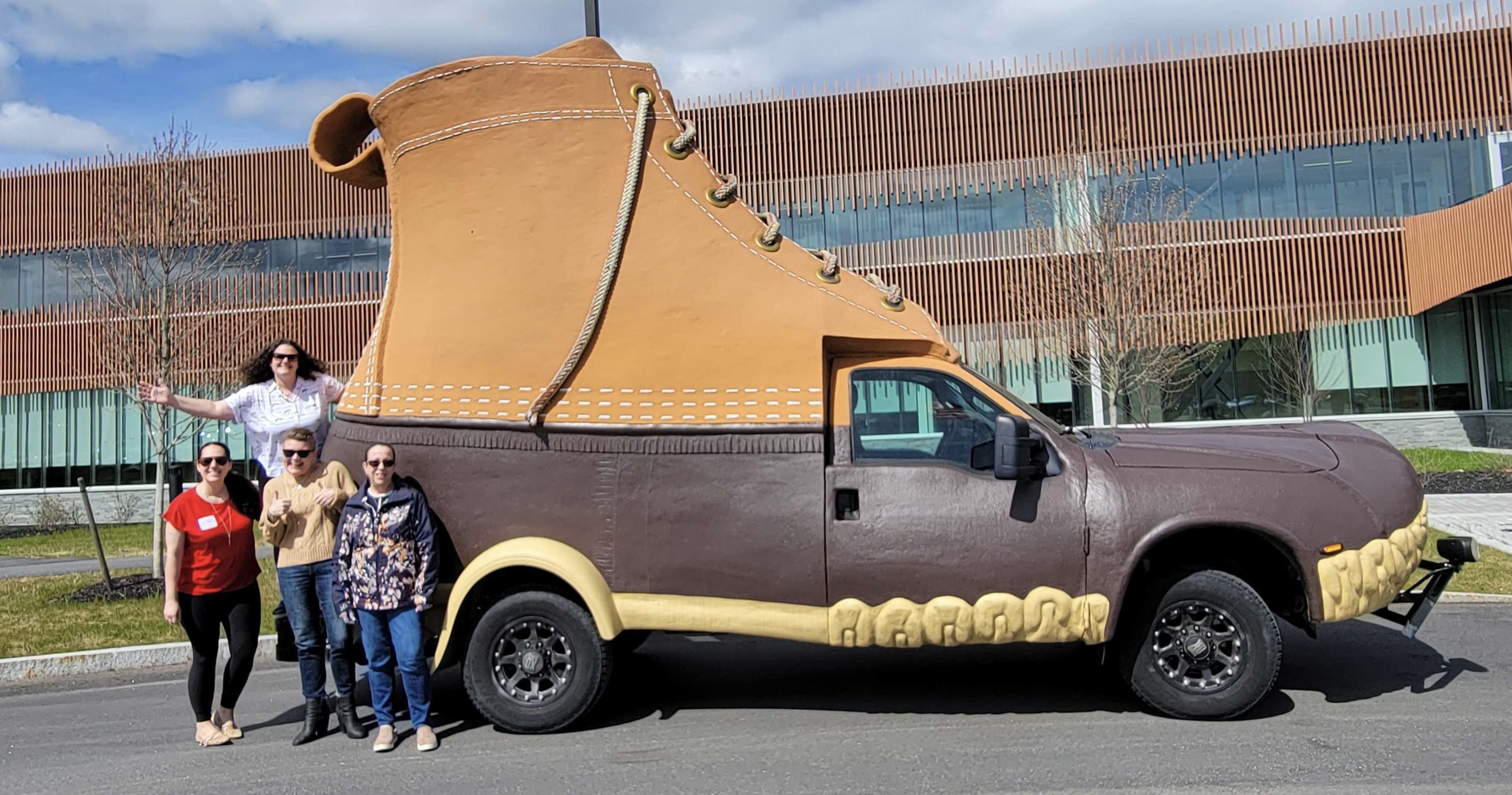 Portland Webworks project managers in front for the LL.Bean Bootmobile.