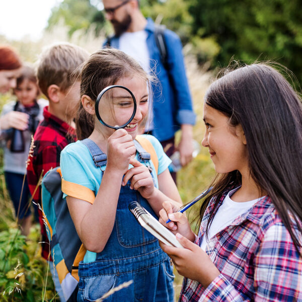 Missouri Department of Conservation photo of students with magnifying glass